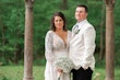 Bride Wearing Dreamy Long Bishop Lace Sleeve Wedding Dress Called Finley By Sottero And Midgley Posing With Groom Outside With Columns