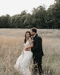 Groom Kissing Bride In Illusion V-back Sheath Wedding Dress Named Angie By Rebecca Ingram