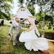 Groom and Bride at an Outdoor Wedding Wearing Lace Ballgown Wedding Dress Called Olivia by Rebecca Ingram