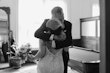 Groom Hugging Bride Wearing Rustic Lace Wedding Dress Called Larkin Lynette By Rebecca Ingram