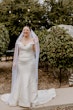 Bride Wearing Simple Fit And Flare Wedding Dress Called Josie By Rebecca Ingram Lauging