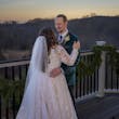 Bride wearing Seneca wedding dress by Sottero and Midgley looking at her husband