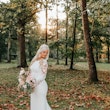 Bride wearing minimalist crepe long sleeve lace sheath wedding dress.