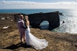 Bride wearing Tuscany Lynette by Maggie Sottero with her husband on a cliff