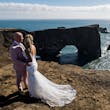 Bride wearing Tuscany Lynette by Maggie Sottero with her husband on a cliff