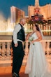 Groom and Bride at a Las Vegas Wedding Wearing Lace Ballgown Called Ellen by Rebecca Ingram