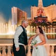 Groom and Bride at a Las Vegas Wedding Wearing Lace Ballgown Called Ellen by Rebecca Ingram