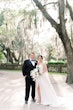 Bride wearing Nisha by Maggie Sottero with her husband