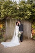 Bride Wearing Simple Keyhole Back Wedding Dress Called Aston By Sottero and Midgley With Groom