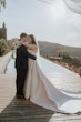 Bride wearing Aspen by Sottero and Midgley embracing her husband