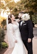 Groom Posing With Real Bride In A White Long Sleeve Wedding Dress Named Nikki By Maggie Sottero