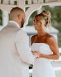 Bride wearing Damiana by Sottero and Midgley holding hands with her husband and smiling