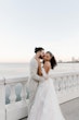 Bride wearing Lettie by Rebecca Ingram being kissed by her husband