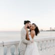 Bride wearing Lettie by Rebecca Ingram being kissed by her husband