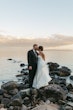 Groom Kissing Bride Wearing Sexy Strapless Wedding Dress Called Zelda By Rebecca Ingram