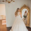 Bride wearing a plus size ballgown wedding dress.
