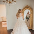 Bride wearing a plus size ballgown wedding dress.