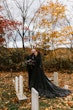 Bride Wearing Black Aline Wedding Dress Called Scarlet By Maggie Sottero With Groom In A Graveyard