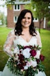 Bride Wearing Long Sleeve Ball Gown Wedding Dress With A Tiered Organza Skirt Tessa By Rebecca Ingram