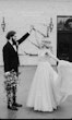 Groom Dancing With Bride Wearing Plunging Lace Illusion Wedding Dress Called Raelynn By Rebecca Ingram