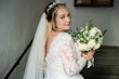 Bride wearing Iris wedding dress by Rebecca Ingram