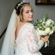 Bride wearing Iris wedding dress by Rebecca Ingram