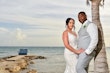 Bride wearing Franklynn by Sottero and Midgley with her husband on the beach