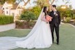 Bride wearing Casey by Maggie Sottero smiling at her husband