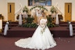 Bride Wearing White Lace Ball Gown 