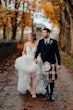 Bride wearing Lettie wedding dress by Rebecca Ingram walking with her husband