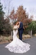 Bride Wearing Lace Crepe Bridal Dress Called Bracken By Sottero And Midgley Kissing Groom