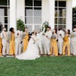 Bride wearing Lettie by Rebecca Ingram with her wedding party