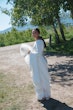 Bride wearing Aston by Sottero and Midgley carrying her dress