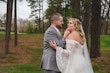 Bride wearing Bronson by Sottero and Midgley with her husband