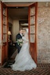 Bride wearing Danielle by Maggie Sottero with her husband