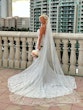 Bride Wearing Lace Mermaid Wedding Dress Called Bronson By Sottero And Midgley Holding A Pink And White Bouquet