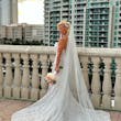 Bride Wearing Lace Mermaid Wedding Dress Called Bronson By Sottero And Midgley Holding A Pink And White Bouquet