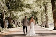 Bride wearing Tuscany Royale by Maggie Sottero walking with her husband