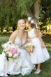 bride in classic sequin  wedding dress called roxanne by sottero and midgley with flower girl