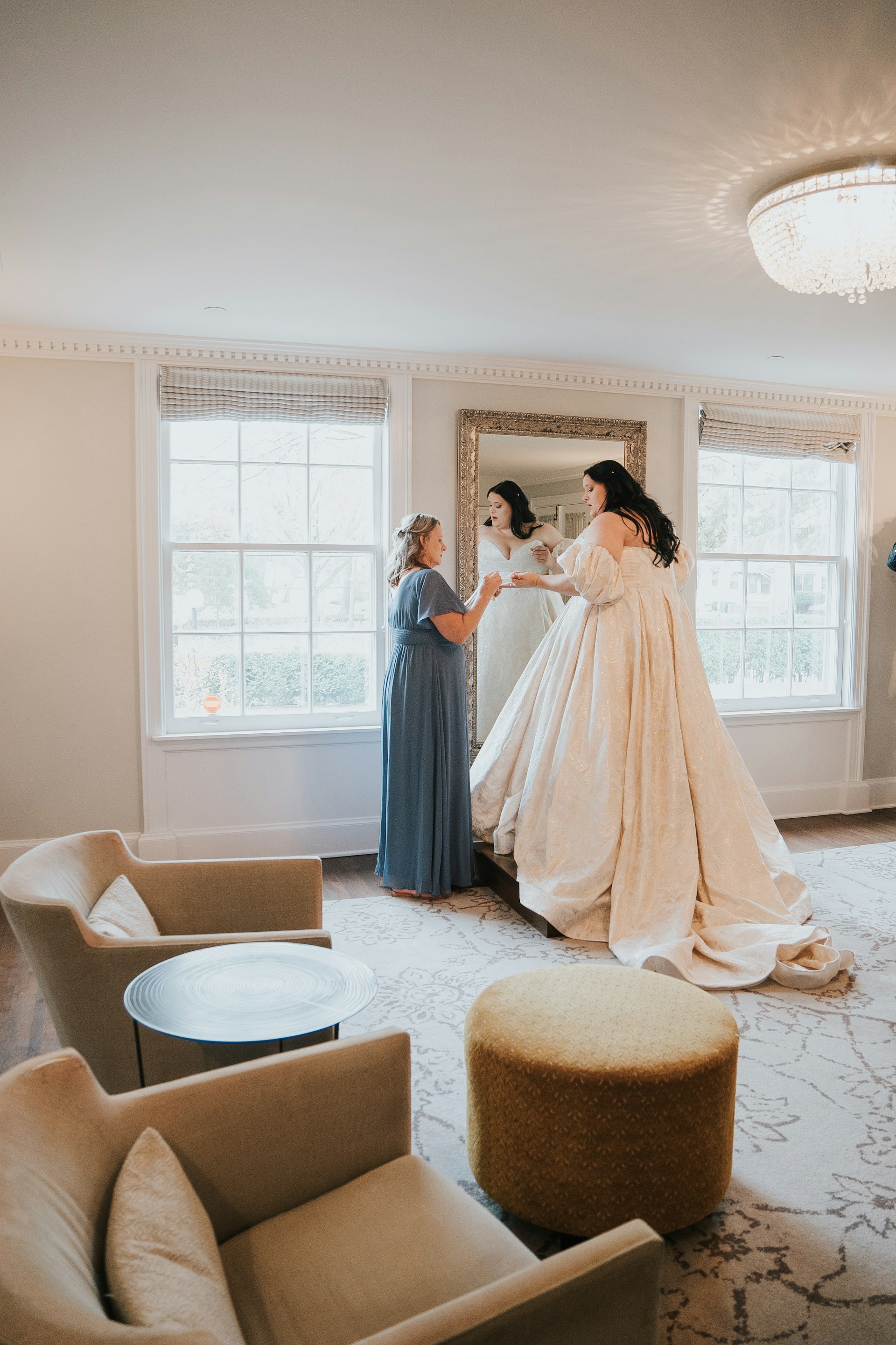 Bride Wearing Floral Jacquard Princess Wedding Gown Called Cyprus By Sottero And Midgley Looking In The Mirror Getting Ready