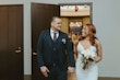 Bride Wearing Lace Crepe Bridal Dress Called Bracken By Sottero And Midgley Holding Hands With Groom