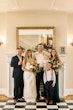 Bride wearing Clover by Rebecca Ingram standing with her family