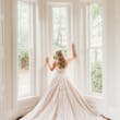 Bride wearing a plus size ballgown wedding dress.