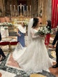 Bride Wearing Glam Long Sleeve Wedding Dress Called Seneca By Sottero And Midgley Holding Her Bouquet