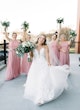 Bride wearing Hattie Lane Marie wedding dress by Rebecca Ingram with bridesmaids