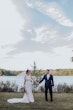 Bride with groom wearing budget friendly fit and flare wedding dress