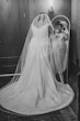 Real Bride Looking In Mirror In White Wedding Dress Named Darius By Maggie Sottero