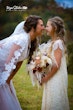 Bride wearing Kingsley wedding gown by Sottero and Midgley with a little girl