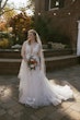 Bride Wearing Asymmetrical Wedding Gown Winona By Rebecca Ingram