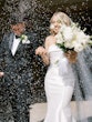 Bride Wearing Simple Fit And Flare Wedding Dress Called Mitchell Marie By Maggie Sottero With Rice Being Thrown